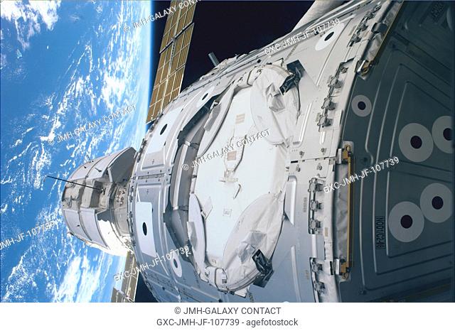 Just a few feet away from the camera lens onboard Endeavour, the Russian-built Zarya control module and the U.S.-built Unity connecting module are connected in...
