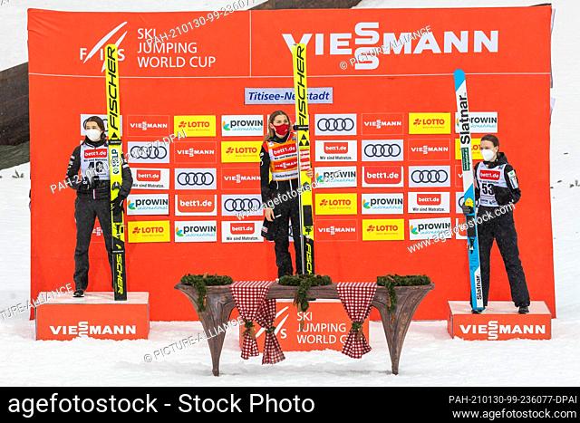 30 January 2021, Baden-Wuerttemberg, Titisee-Neustadt: Nordic skiing/ski jumping: World Cup, large hill, women, 2nd round: Norwegian Silje Opseth (from left