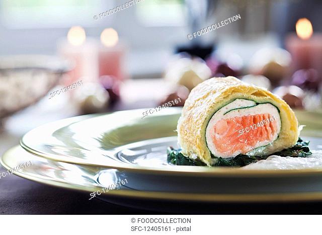Salmon strudel on spinach for Christmas