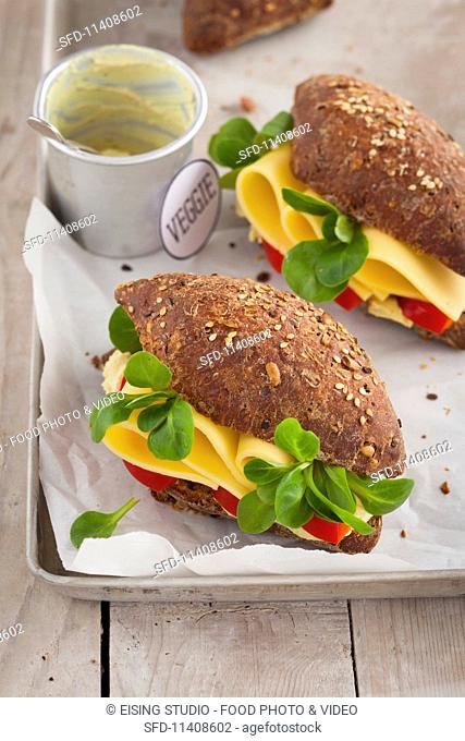 Vegetarian cheese sandwiches with fresh lamb's lettuce