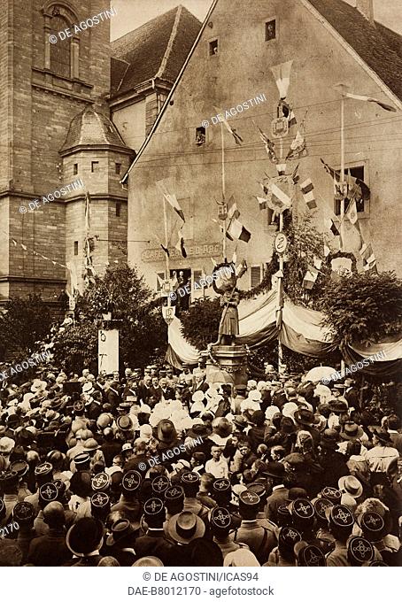 Henri Poincare delivering a patriotic speech in front of the monument to Joan of Arc, delivery of the Cross of the Legion d'honneur to the town of Bitche