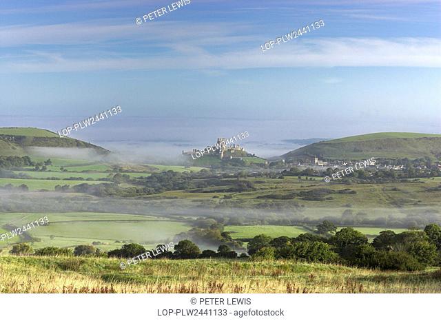 England, Dorset, Corfe Castle. View from Kingston towards Corfe Castle surrounded by early morning mist