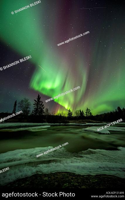 Aurora dancing over Pinawa Dam, Manitoba, Canada