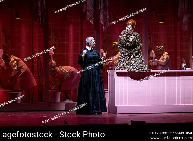 PRODUCTION - 29 March 2023, Baden-Württemberg, Baden-Baden: Michaela Schuster as ""The Nurse"" (l) and Miina-Liisa Värelä as ""The Dyer"" (r) stand on the stage...