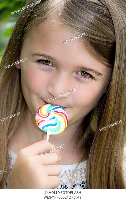 Portrait of girl with lollipop