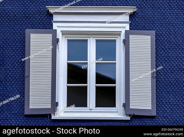 Old wooden window with blinds. No people. Front view. Old fashioned style