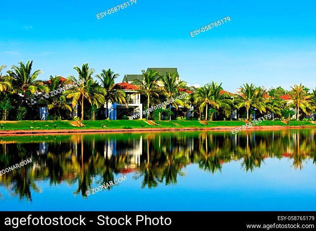 beautiful villas on the shore of pond