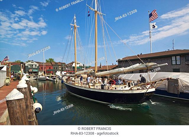 The 80 foot excursion schooner Aquidneck returning to Bowen's Wharf, established in 1760 and now a busy waterfront retail and tourist centre, Newport