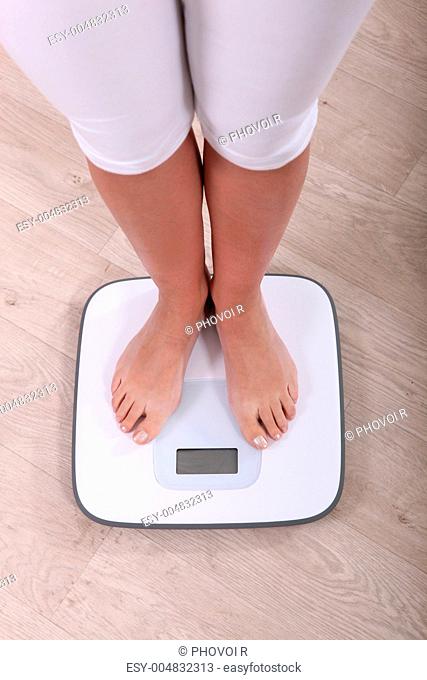 woman weighing herself