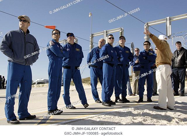 CAPE CANAVERAL, Fla. - On Launch Pad 39A at NASA's Kennedy Space Center in Florida, STS-119 crew members listen to instructions about using the slidewire...