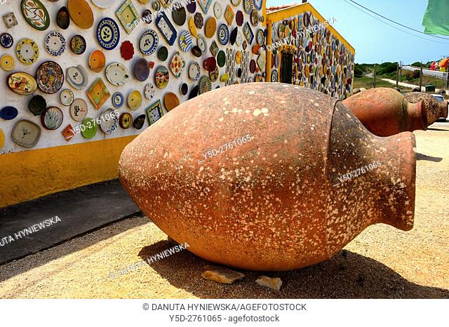 Europe, Portugal, Southern Portugal , Algarve region , Faro district , Portuguese traditional huge clay pitchers used as decoration in front of shop selling...