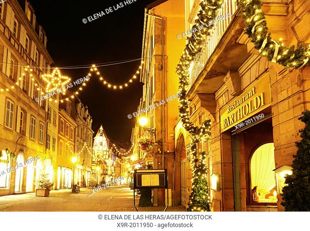 """""Bartholdi"" restaurant witn Christmas lights at the city center by night. Colmar. Wine route. Haut-Rhin. Alsace. France
