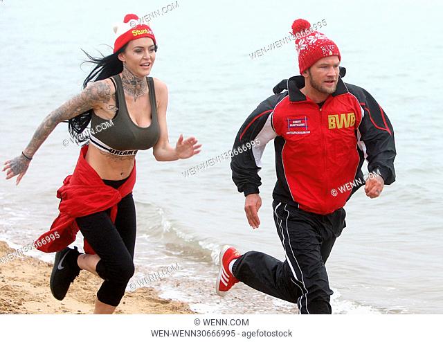 Robin Deakin, aka 'Britains Worst Boxer, ' on a training run at Chalkwell Beach, Essex, with his glamorous training partner Stacey, 27, from London