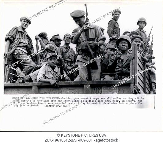 May 12, 1961 - Back from the Front--Laotian government troops are all smiles as they sit in truck to enroute to Vientiane from the front lines as a cease-fire...