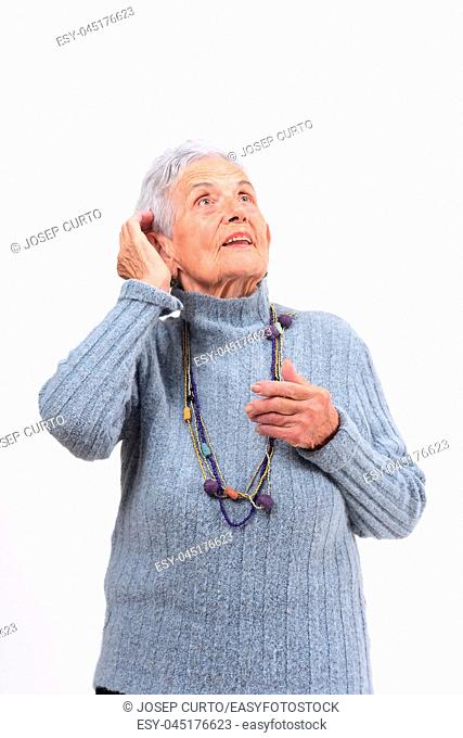 senior woman having a doubt or question on white background
