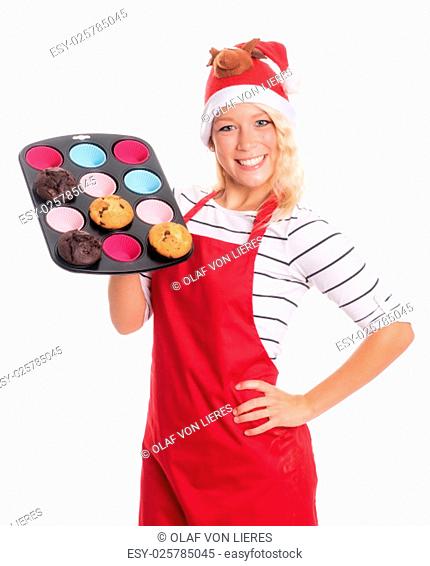 woman with santa hat offers homemade muffins