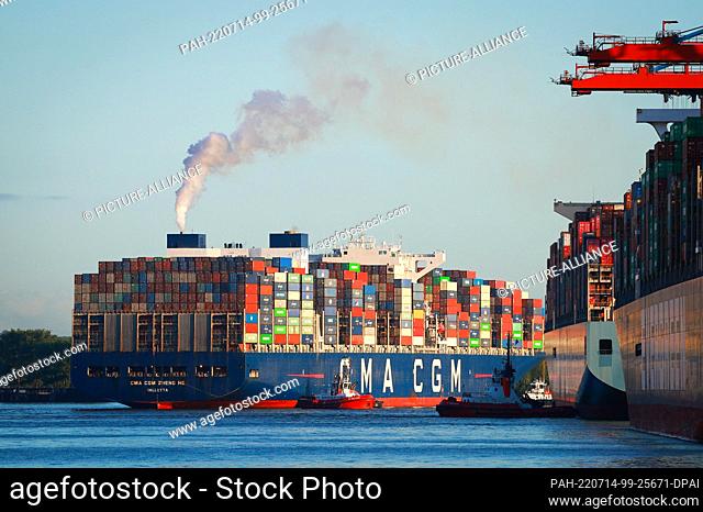 14 July 2022, Hamburg: The container ship CMA CMG Zheng He of the shipping company CMA CMG docks at Waltershofer Hafen. Photo: Christian Charisius/dpa