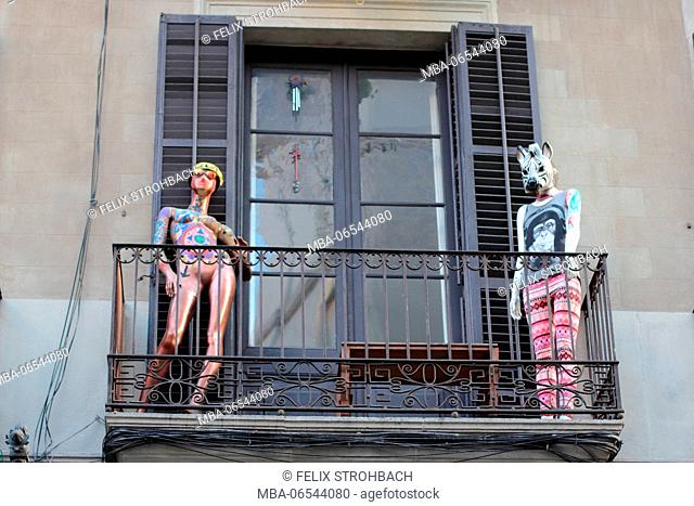 Two full-size figures on a balcony