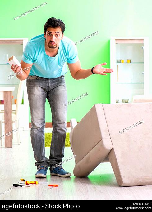 The man repairing furniture at home