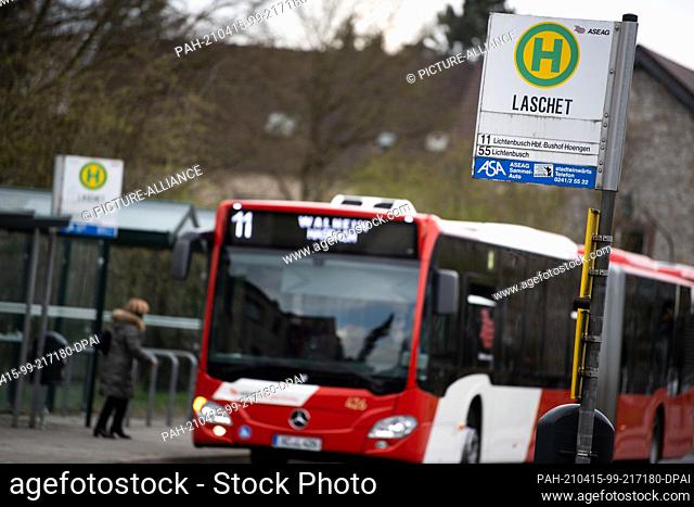15 April 2021, North Rhine-Westphalia, Oberforstbach: A bus stops at the Laschet bus stop. The CDU party leader of the same name and North Rhine-Westphalian...