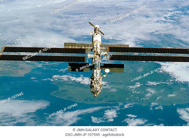 This high-angle view is one of a series of digital still camera photographs showing the International Space Station (ISS) during a fly-around by the Space...