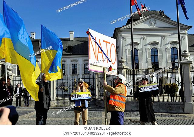 Both supporters of Ukraine and opposers to NATO demonstrate prior to the meeting of Russian Foreign Minister Sergey Lavrov and Slovak President Andrej Kiska in...
