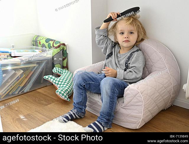 Little blond boy, 4 years, brushing his hair, children's room, Baden-Württemberg, Germany, Europe