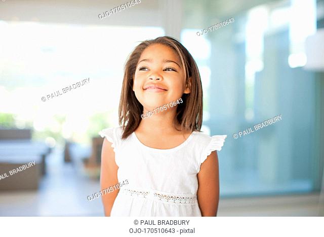 Smiling Girl standing in home