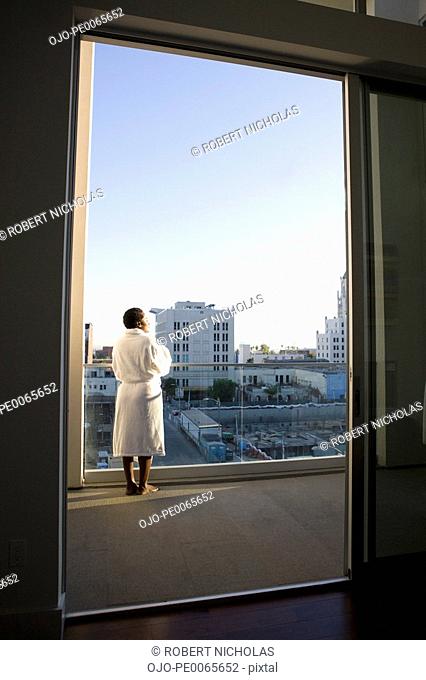 Woman enjoying view from balcony