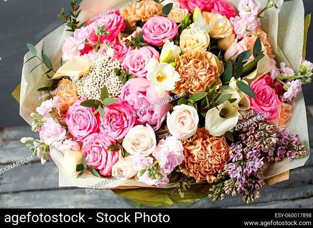 Vintage dark grunge wood texture with empty space decorating by old rose and mixed flowers sweet romantic concept