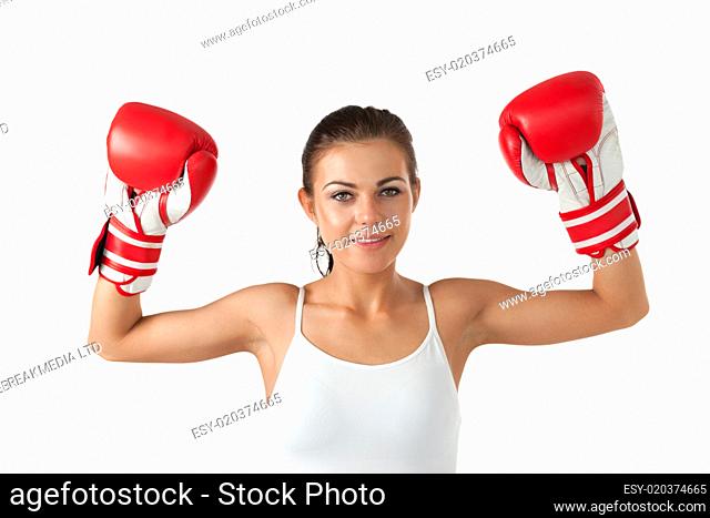 Female boxer raising her arms