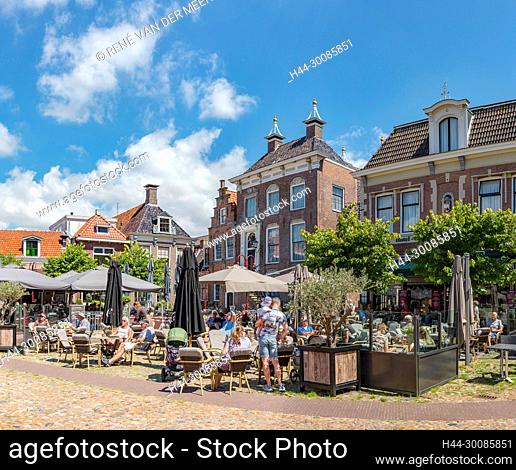 Marketsquare with the town hall and an outdoor cafe, Workum, Friesland, Netherlands