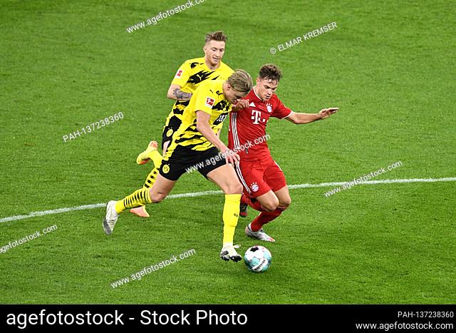 Erling HAALAND (DO), Marco REUS (DO) and Joshua KIMMICH (M) action, duels, soccer 1st Bundesliga, 7th matchday, Borussia Dortmund (DO) - FC Bayern Munich (M) 2:...