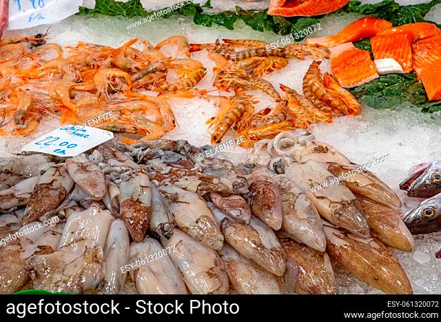 Squid, shrimps and salmon for sale at a market in Barcelona
