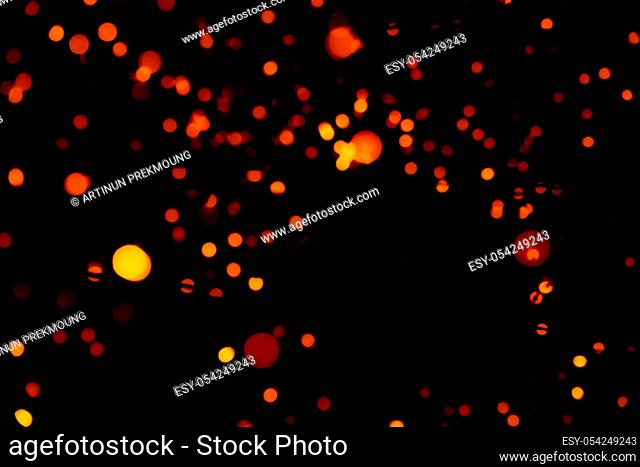 Christmas and happy new year decoration light. Red and orange color bokeh background with beautiful pattern. Defocused Xmas light in the night of party
