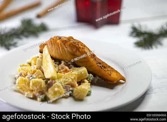 Traditional Christmas dinner in Czech Republic - salmon fillet with potato salad