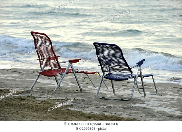 Old, empty deck chairs at the beach of the northern Adriatic Sea near Cavallino camping site, Jesolo, Venice, Italy, Europe