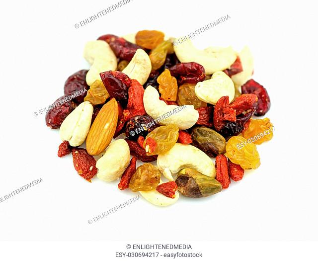 Macro closeup of mixed nuts and dried fruits isolated on white