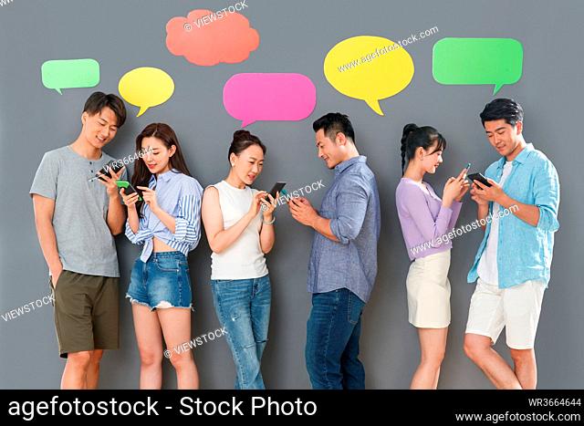 Happy couples use mobile phone chat software to communicate