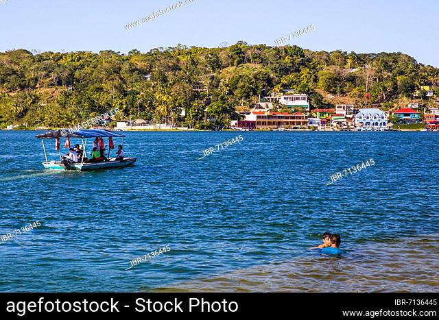 Flores is located on an island in the small Petén-Itzá Lake, Flores, Guatemala, Central America