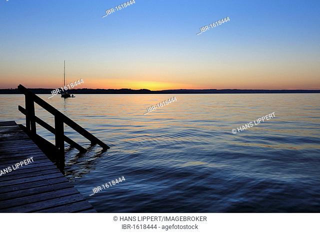 Sunset on Starnberger See or Lake Starnberg, pier at Buchscharner Seewirt at St. Heinrich, Muensing, Upper Bavaria, Bavaria, Germany, Europe
