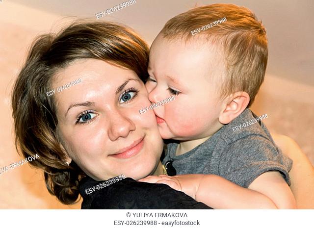 Photo of happiest mother with her kissing son