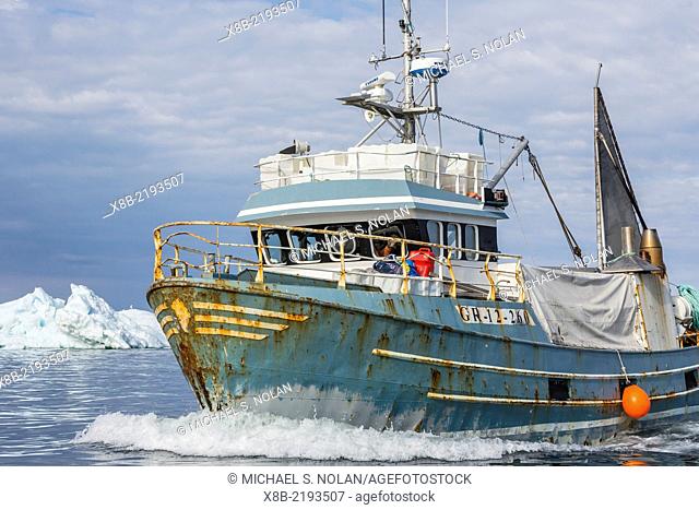 Commercial fishing boat returning from sea to the town of Ilulissat, Greenland