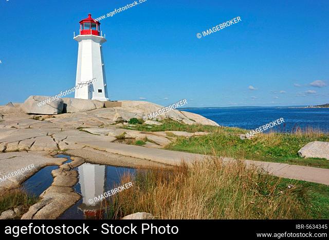 View of granite rock lighthouse, Peggys Point Lighthouse, Peggys Cove, St. Margarets Bay, Nova Scotia, Canada, North America