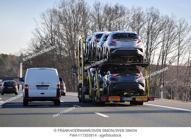 Truck transports cars, car transport, road, car transporter, cars, overpass, new cars, Toyota. Car traffic, road traffic, goods traffic, A9 | usage worldwide