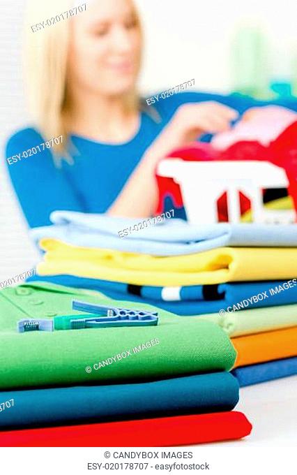 Laundry clothespin - woman folding clothes
