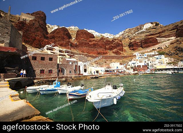 View to the traditional fishing boats and traditional Cycladic buildings in Ammouidi bay below Oia village , Santorini Island, Cyclades Islands, Greek Islands
