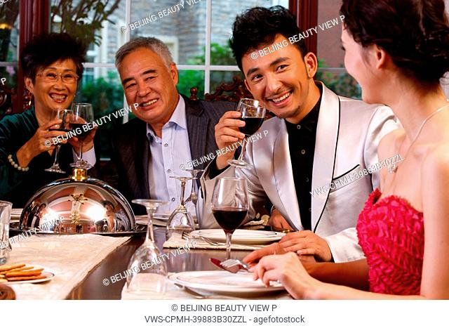Luxury family having dinner together