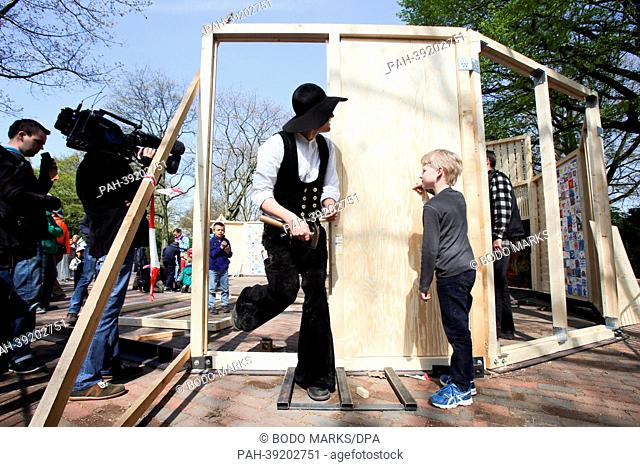 Carpenters, helpers and children build a children's cathedral at the Wallanlagen in Hamburg, Germany, 03 May 2013. More than 100