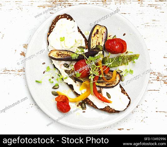 Open faced sandwiches with cream cheese and grilled vegetables